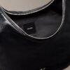 Bolso bandolera convertible con forma curvada