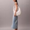 Bolso bandolera convertible con forma curvada Bolso bandolera convertible con forma curvada