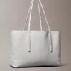 Bolso tote con el logotipo del emblema por toda la superficie y bolsillo Bolso tote con el logotipo del emblema por toda la superficie y bolsillo