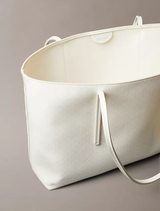 Bolso tote con el logotipo del emblema por toda la superficie y bolsillo Bolso tote con el logotipo del emblema por toda la superficie y bolsillo