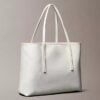 Bolso tote pequeño con estampado del logotipo en todo el tejido y bolsillo Bolso tote pequeño con estampado del logotipo en todo el tejido y bolsillo