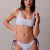 Braguita de bikini con lazo lateral y monograma gráfico Braguita de bikini con lazo lateral y monograma gráfico