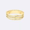 Brazalete con bisagra de forma fluida y escultural Brazalete con bisagra de forma fluida y escultural