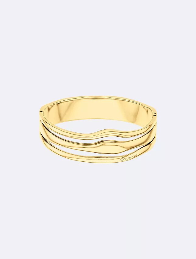 Brazalete con bisagra de forma fluida y escultural Brazalete con bisagra de forma fluida y escultural