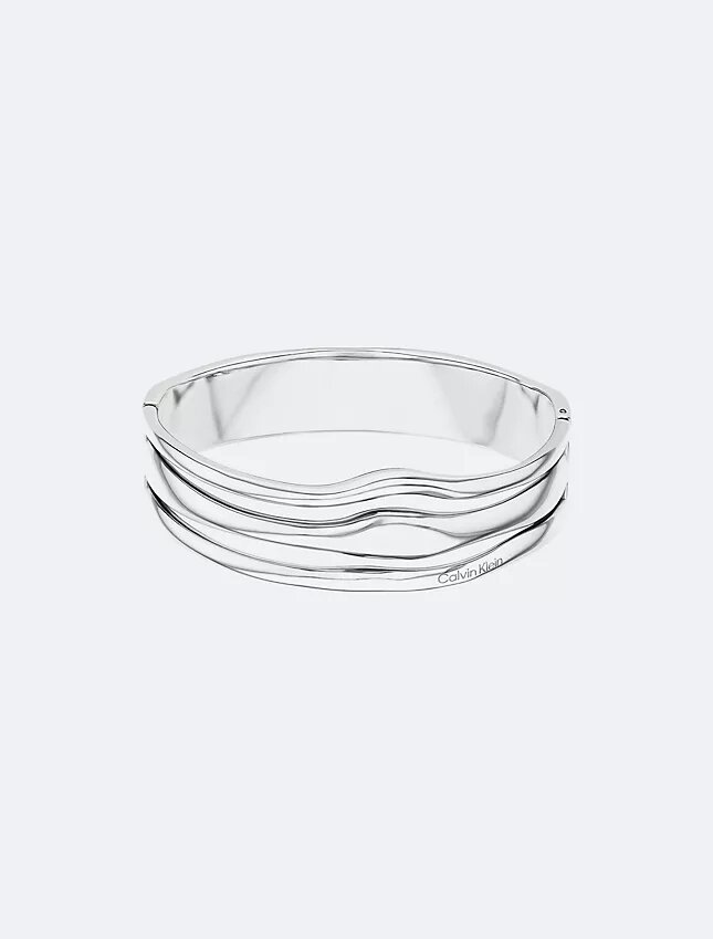 Brazalete con bisagra de forma fluida y escultural Brazalete con bisagra de forma fluida y escultural