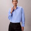 Camisa corta de popelín con botones y corte holgado Camisa corta de popelín con botones y corte holgado