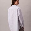 Camisa de popelín a rayas con botones y corte holgado Camisa de popelín a rayas con botones y corte holgado