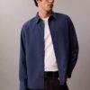 Camisa de popelín lavado con cuello de punta y corte holgado