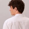 Camisa de popelín lavado con cuello de punta y corte holgado