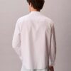 Camisa de popelín lavado con cuello de punta y corte holgado