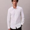 Camisa entallada elástica con botones Camisa entallada elástica con botones