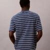 Camiseta holgada con logotipo de rayas