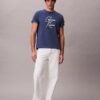 Camiseta holgada con logotipo en letra cursiva Camiseta holgada con logotipo en letra cursiva