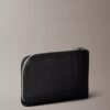 Cartera con cremallera y monogram en relieve por toda la superficie Cartera con cremallera y monogram en relieve por toda la superficie