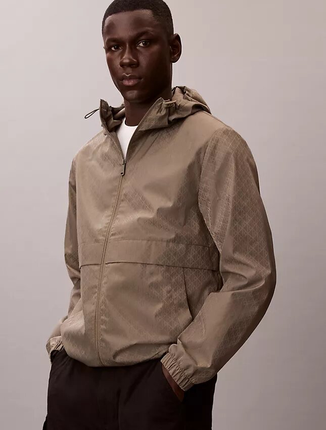 Chaqueta cortavientos con logotipo en todo el tejido Chaqueta cortavientos con logotipo en todo el tejido