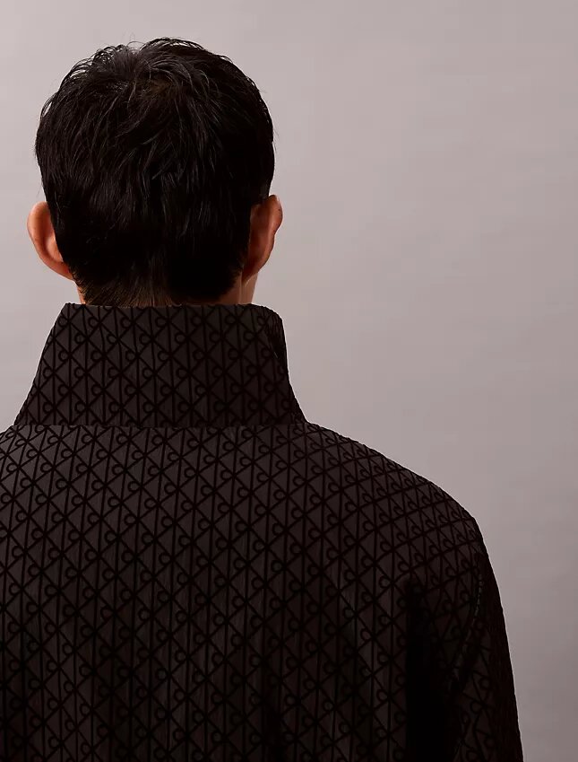 Chaqueta reversible con logotipo en todo el tejido Chaqueta reversible con logotipo en todo el tejido