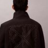 Chaqueta reversible con logotipo en todo el tejido Chaqueta reversible con logotipo en todo el tejido