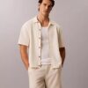 Jersey con botones y punto de malla