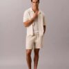 Jersey con botones y punto de malla