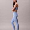 Leggings deportivos modernos de talle alto con logo en la cintura y corte 7/8