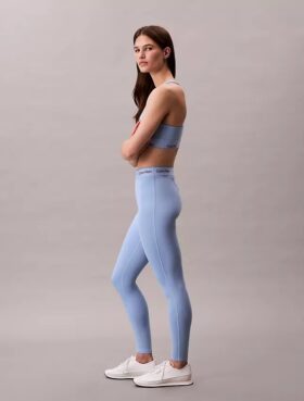 Leggings deportivos modernos de talle alto con logo en la cintura y corte 7/8