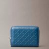 Monogram con cremallera y monograma en relieve por toda la superficie