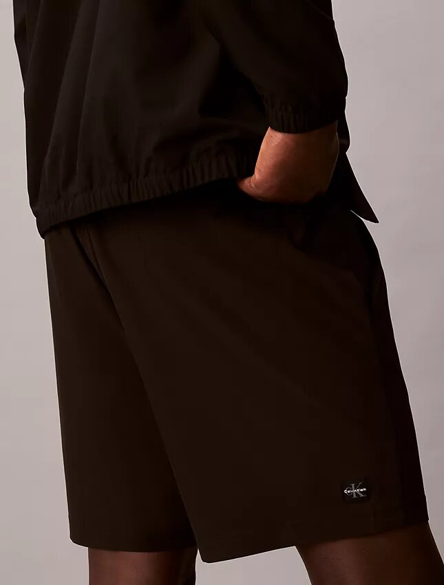 Pantalones cortos con monograma estampado Pantalones cortos con monograma estampado