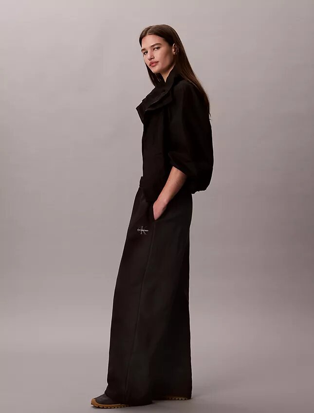 Pantalones de chándal de felpa de pierna ancha con monólogo Pantalones de chándal de felpa de pierna ancha con monólogo