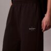 Pantalones de chándal de felpa de pierna ancha con monólogo Pantalones de chándal de felpa de pierna ancha con monólogo