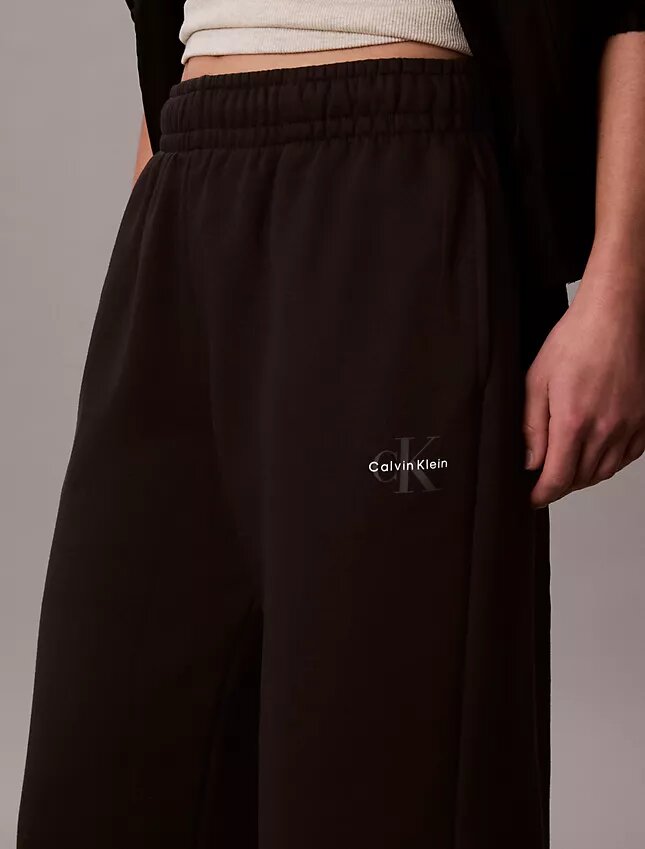Pantalones de chándal de felpa de pierna ancha con monólogo Pantalones de chándal de felpa de pierna ancha con monólogo