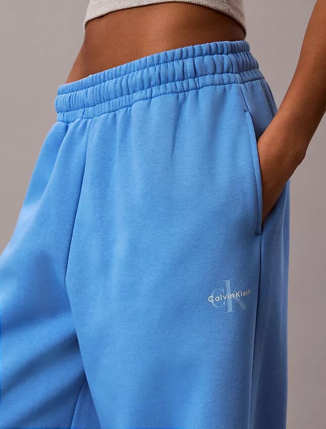Pantalones de chándal de felpa de pierna ancha con monólogo Pantalones de chándal de felpa de pierna ancha con monólogo