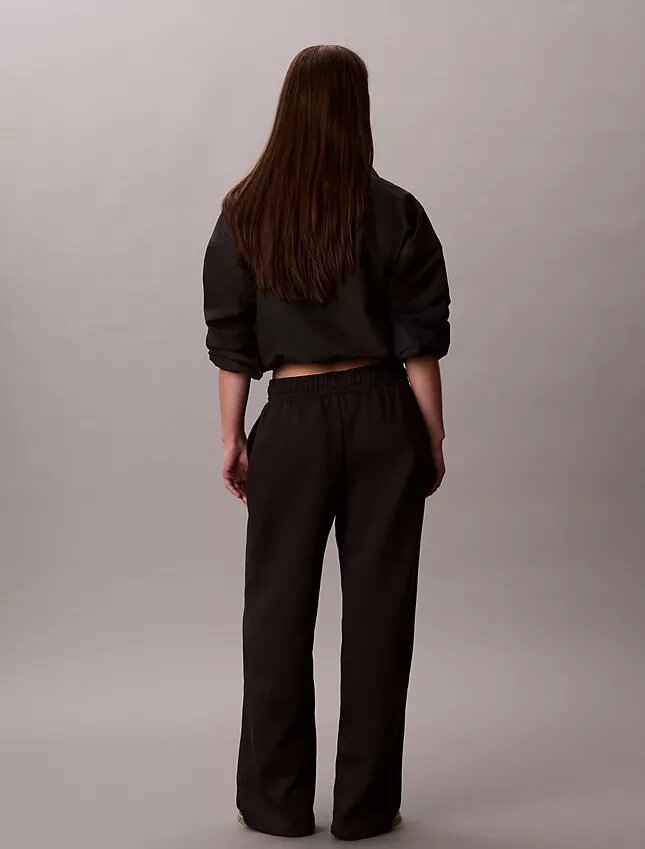 Pantalones de chándal de felpa de pierna ancha con monólogo Pantalones de chándal de felpa de pierna ancha con monólogo
