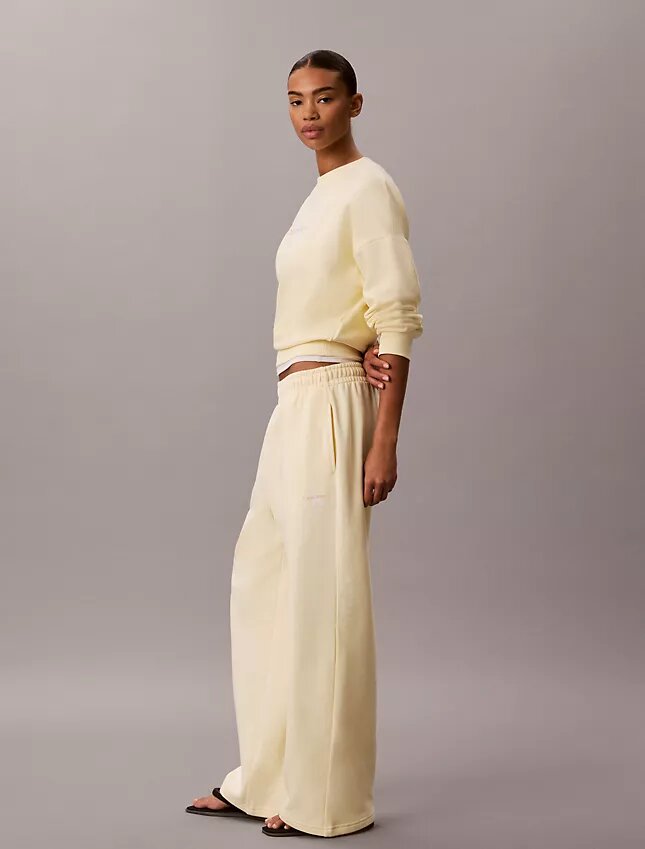 Pantalones de chándal de felpa de pierna ancha con monólogo Pantalones de chándal de felpa de pierna ancha con monólogo