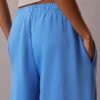 Pantalones de chándal de felpa de pierna ancha con monólogo Pantalones de chándal de felpa de pierna ancha con monólogo