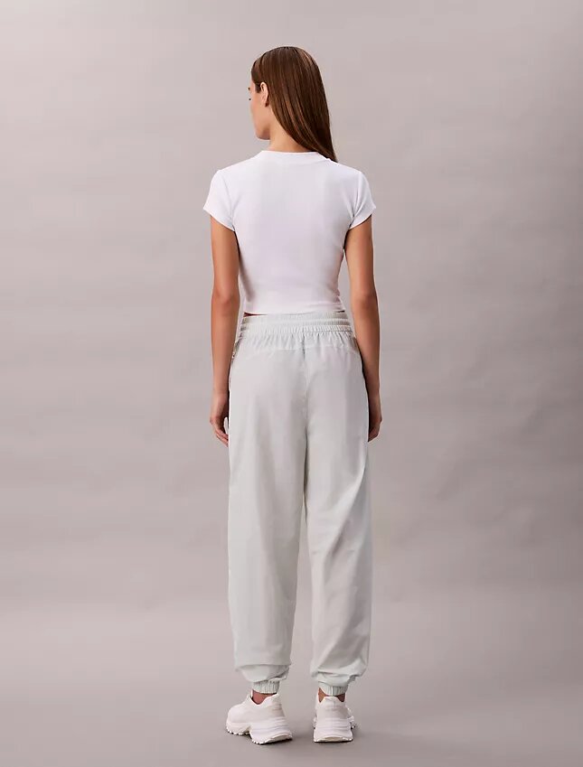 Pantalones de chándal sin cordón con gráfico del logotipo Monogram Pantalones de chándal sin cordón con gráfico del logotipo Monogram