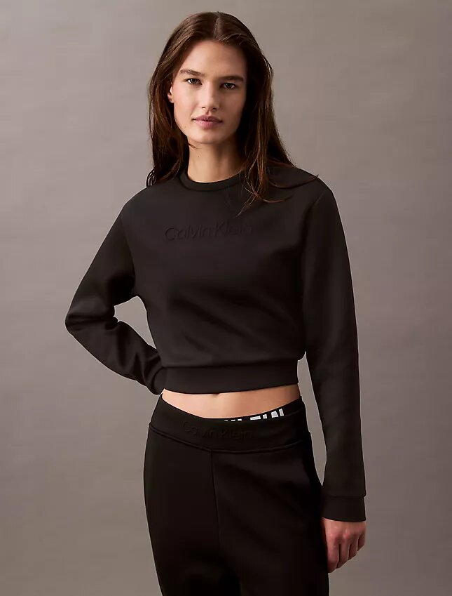Sudadera corta de cuello redondo con tejido espaciado Sudadera corta de cuello redondo con tejido espaciado