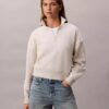 Sudadera de cuello alto con cremallera de un cuarto de longitud y logo de archivo